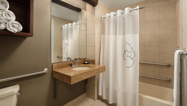 The bathroom in the accessible Wolf Den Suite